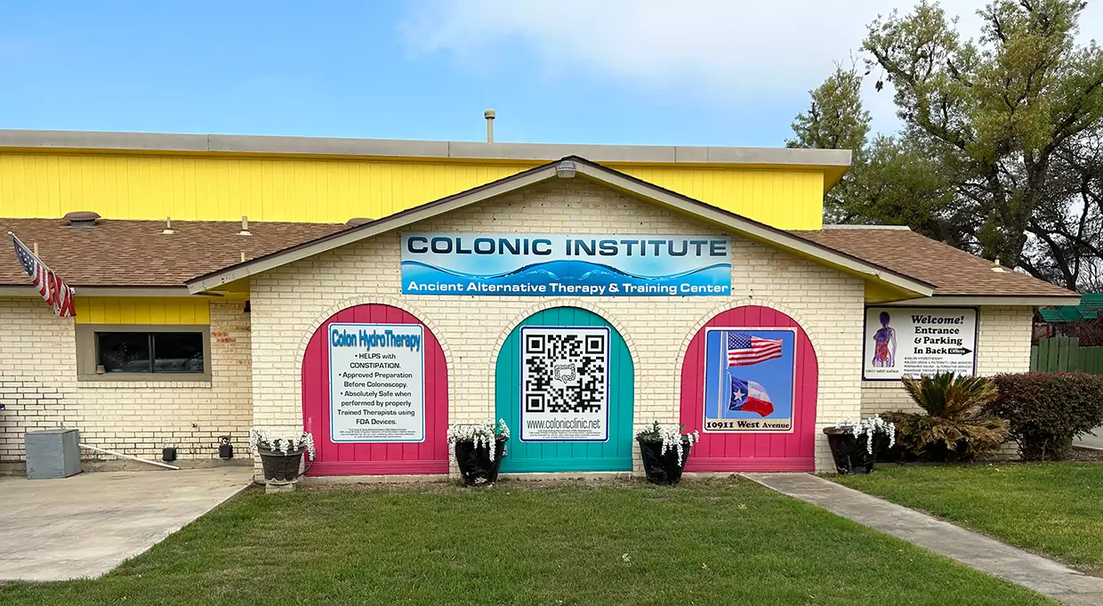 Colonic Clinic store front painted bright yellow